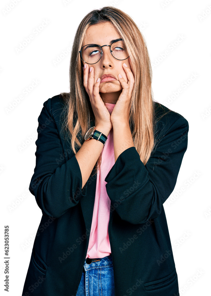 Hispanic young woman wearing business jacket and glasses tired hands covering face, depression and sadness, upset and irritated for problem Hispanic young woman wearing business jacket and glasses tired hands covering face, depression and sadness, upset and irritated for problem