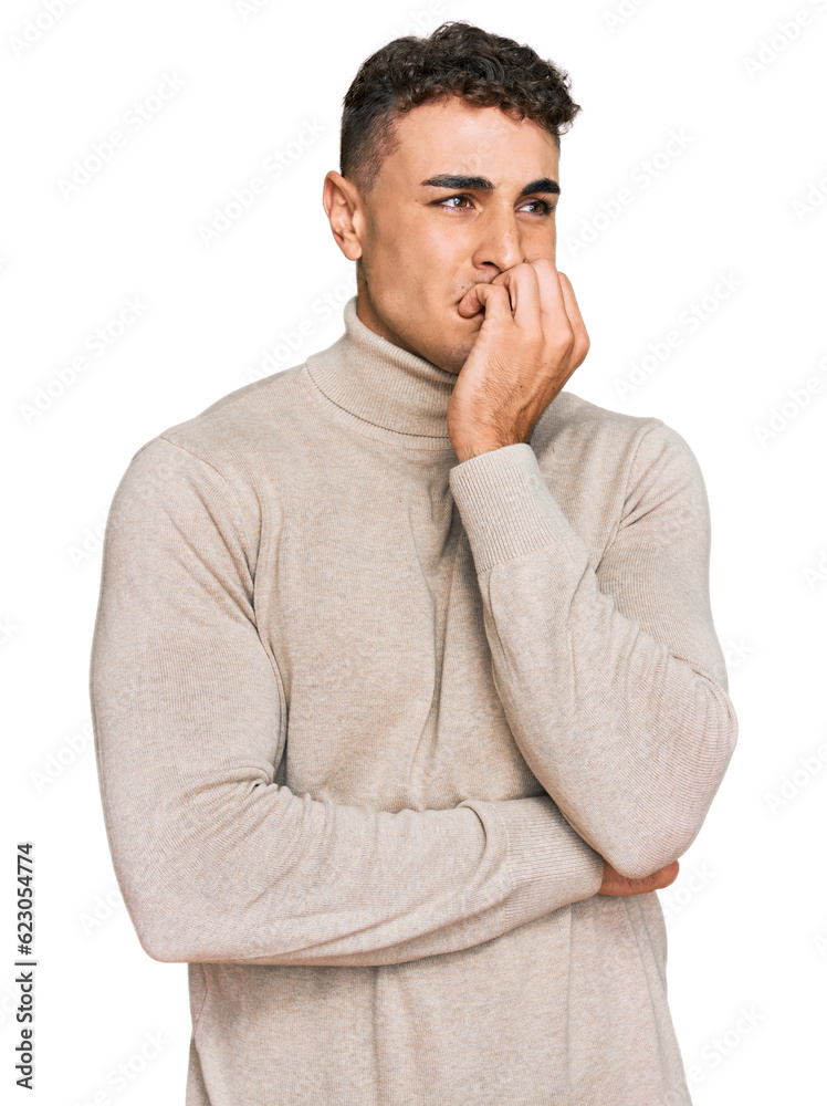 Hispanic young man wearing casual turtleneck sweater looking stressed and nervous with hands on mouth biting nails. anxiety problem. Hispanic young man wearing casual turtleneck sweater looking stressed and nervous with hands on mouth biting nails. anxiety problem.