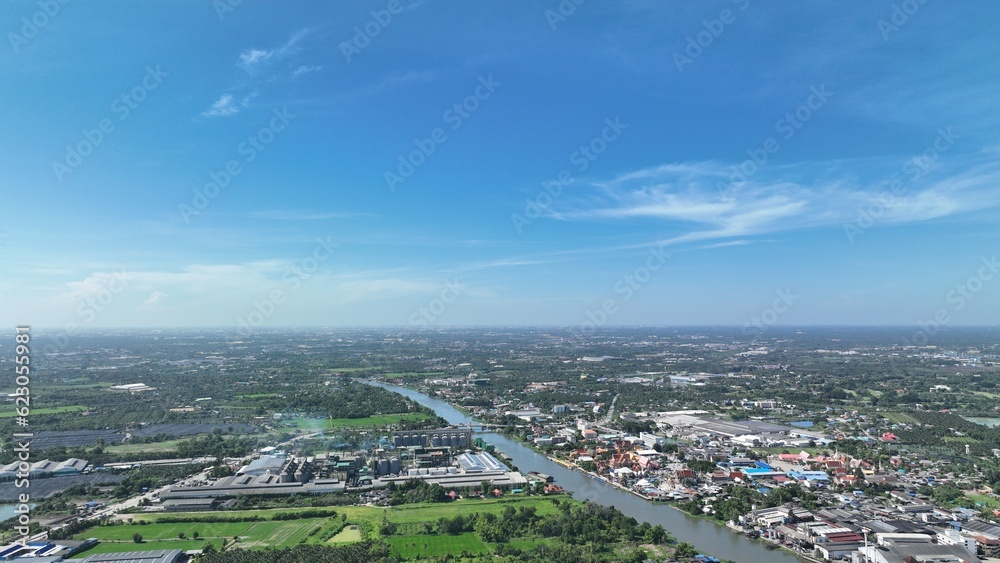 flying with blue sky day time view above little country side city with pollution and storm so far on horizon flying with blue sky day time view above little country side city with pollution and storm so far on horizon