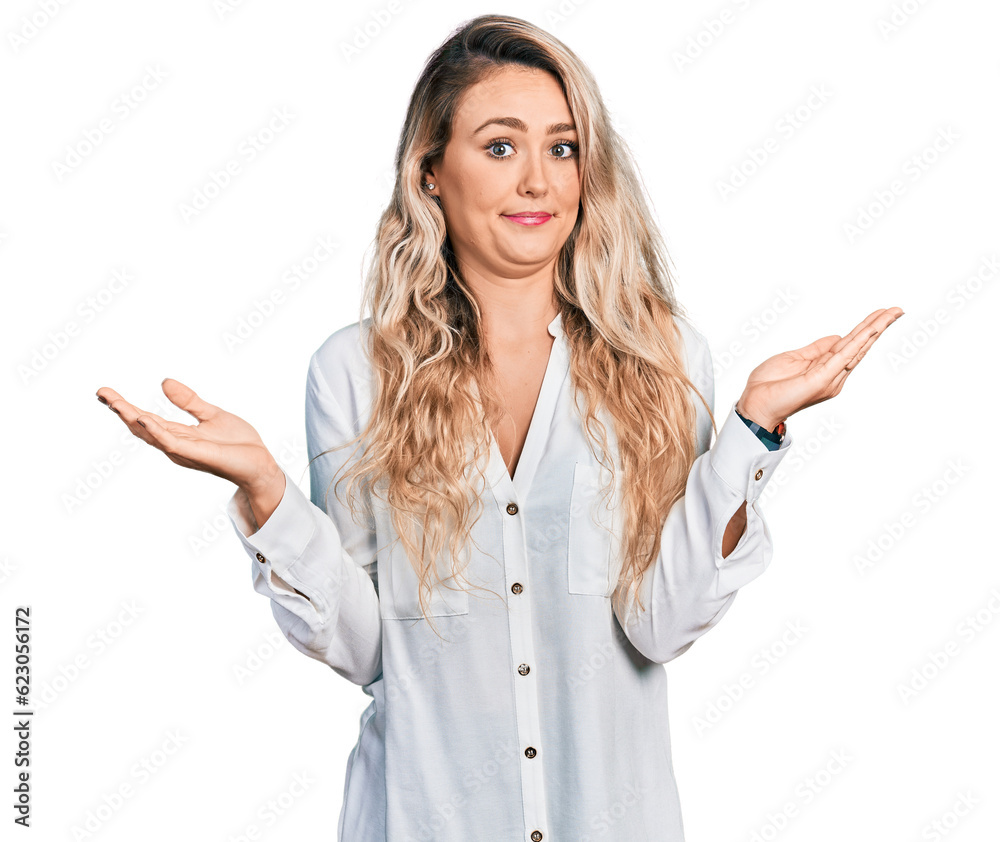 Young blonde woman wearing casual clothes clueless and confused with open arms, no idea and doubtful face. Young blonde woman wearing casual clothes clueless and confused with open arms, no idea and doubtful face.