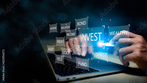 Investment wealth stock concept. Businessman using laptop analyzing data to online invest form. Business data analyzing growth in the digital. Digital transformation for next generation technology.