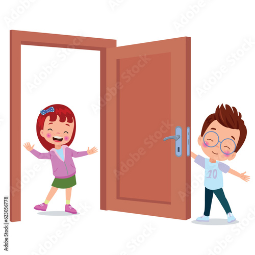 little kid standing and holding door knob