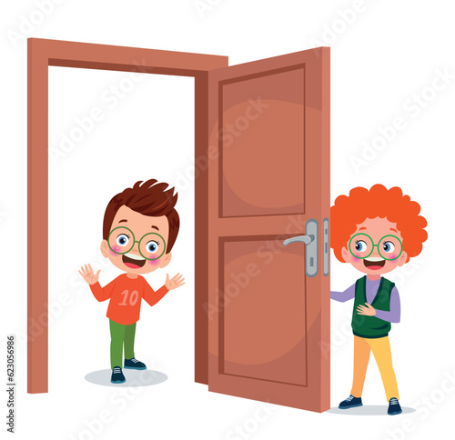 little kid standing and holding door knob