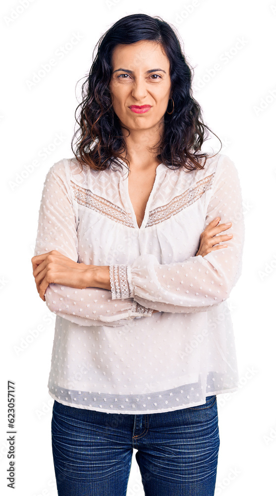 Young beautiful hispanic woman wearing casual clothes skeptic and nervous, disapproving expression on face with crossed arms. negative person. Young beautiful hispanic woman wearing casual clothes skeptic and nervous, disapproving expression on face with crossed arms. negative person.