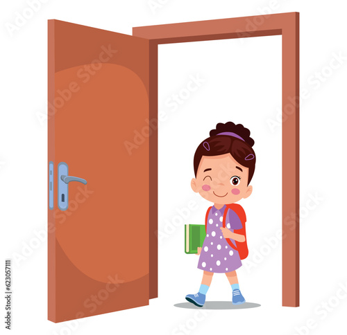 little kid standing and holding door knob
