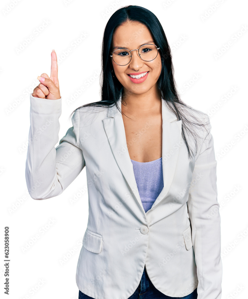 Beautiful hispanic woman with nose piercing wearing business jacket and glasses showing and pointing up with finger number one while smiling confident and happy. Beautiful hispanic woman with nose piercing wearing business jacket and glasses showing and pointing up with finger number one while smiling confident and happy.