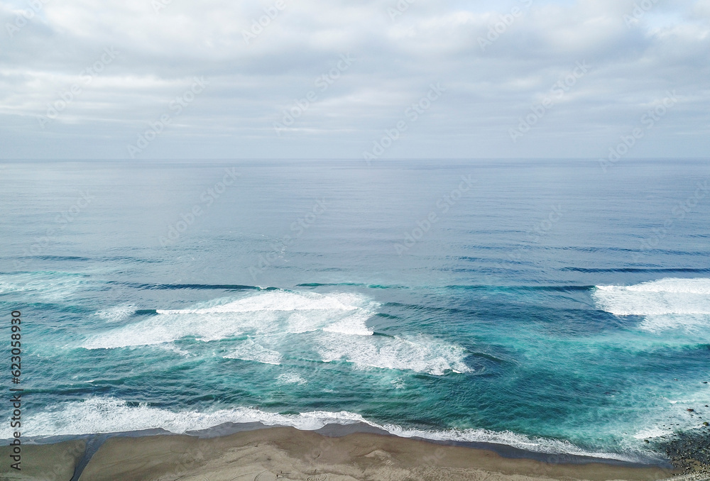 Aerial view of the beach with waves in the Atlantic ocean. Ribeira Grande São Miguel Island in the Azores. Aerial view of the beach with waves in the Atlantic ocean. Ribeira Grande São Miguel Island in the Azores.