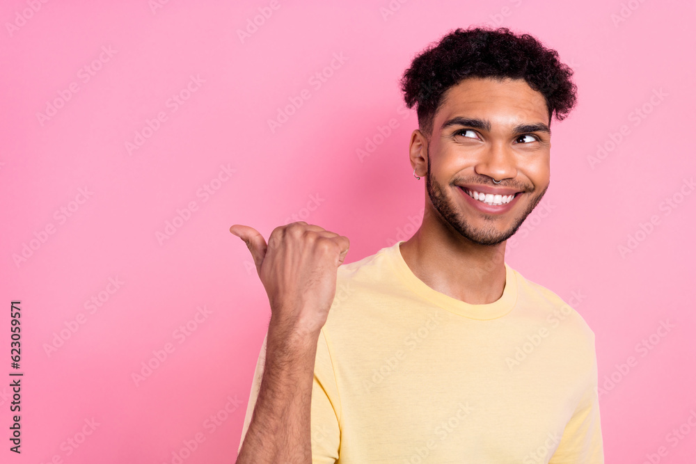 Photo of nice wondered guy showing novelty copyspace empty space look interested wear shirt isolated pink color background Photo of nice wondered guy showing novelty copyspace empty space look interested wear shirt isolated pink color background