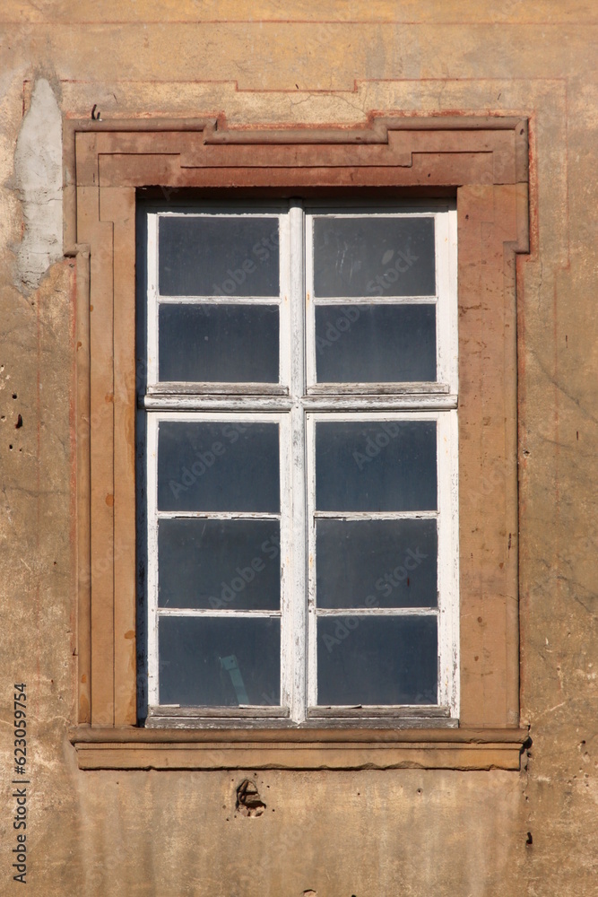 Baroque window with dirty panes and peeling paint on the dilapidated Augustinian monastery facade in Pfaffen-Schwabenheim, Germany Baroque window with dirty panes and peeling paint on the dilapidated Augustinian monastery facade in Pfaffen-Schwabenheim, Germany