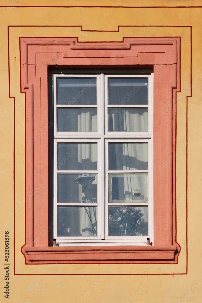 Baroque window with dirty broken panes on the Augustinian monastery facade in Pfaffen-Schwabenheim, Germany Baroque window with dirty broken panes on the Augustinian monastery facade in Pfaffen-Schwabenheim, Germany