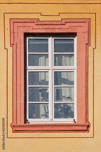 Baroque window with dirty broken panes on the Augustinian monastery facade in Pfaffen-Schwabenheim  Germany
