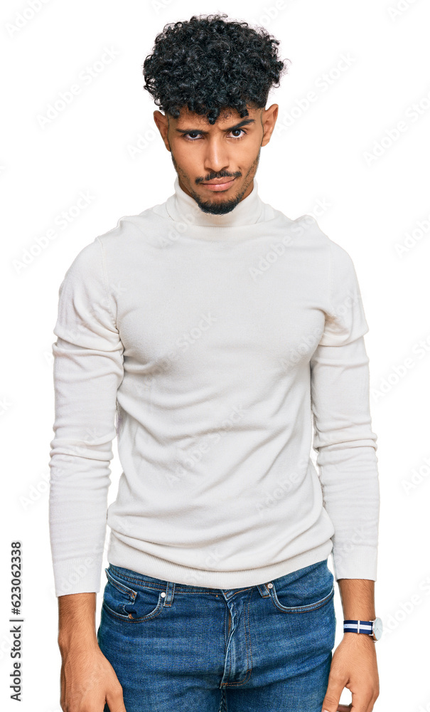 Young arab man wearing casual winter sweater skeptic and nervous, frowning upset because of problem. negative person. Young arab man wearing casual winter sweater skeptic and nervous, frowning upset because of problem. negative person.