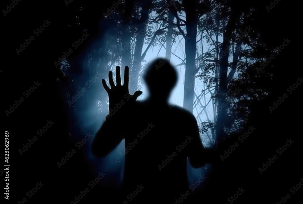 scary scene of a person placing their open hands in front, silhouette, dark background scary scene of a person placing their open hands in front, silhouette, dark background