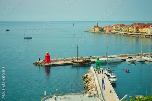Green and red lighthouses in the port of Piran, Slovenia