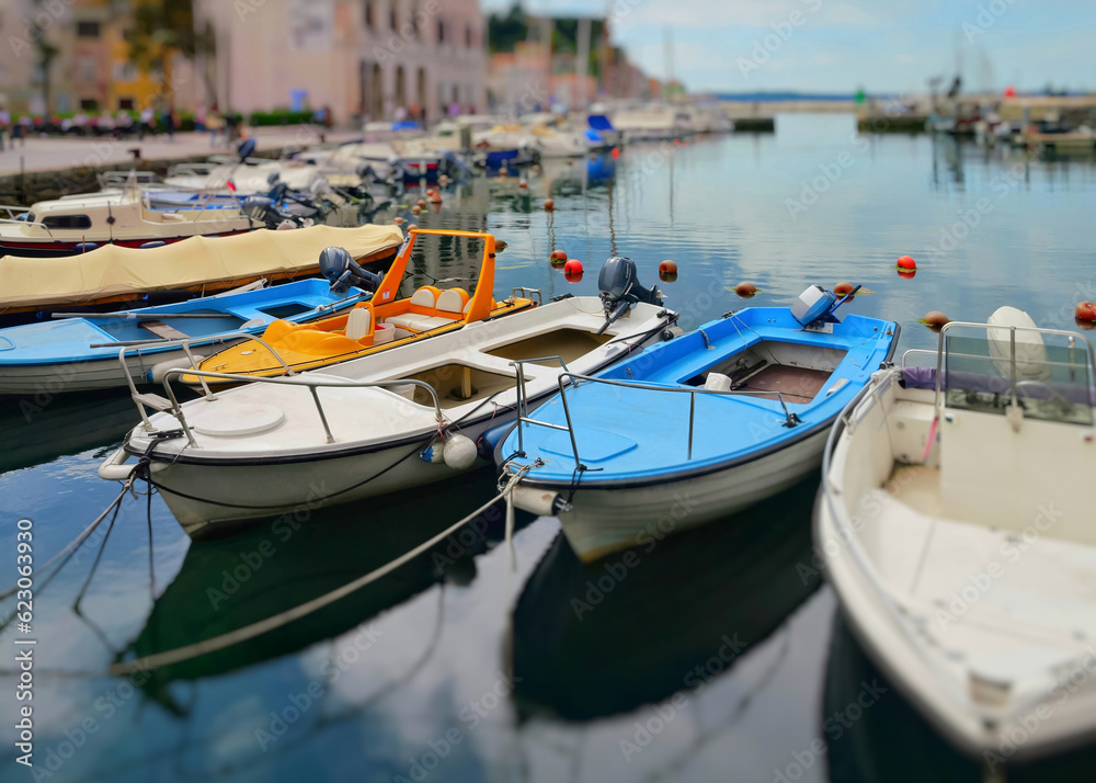 Multi-colored boats on the pier in the port of Piran, Slovenia.