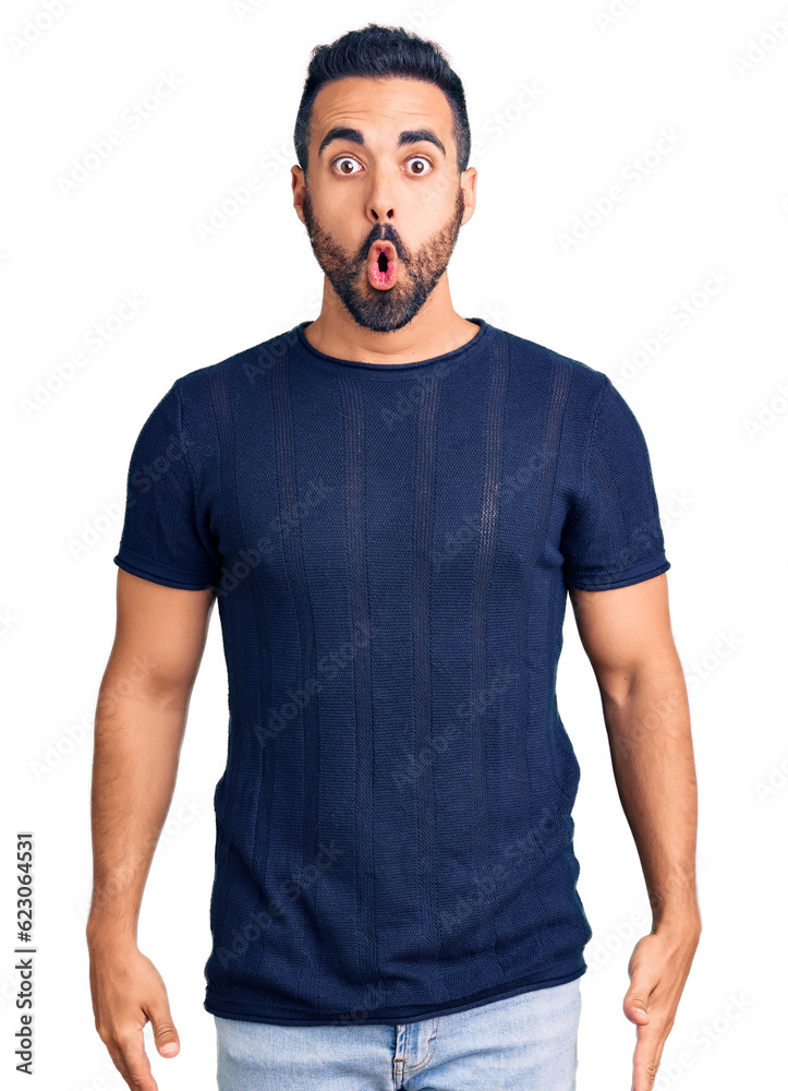 Young hispanic man wearing casual clothes scared and amazed with open mouth for surprise, disbelief face Young hispanic man wearing casual clothes scared and amazed with open mouth for surprise, disbelief face