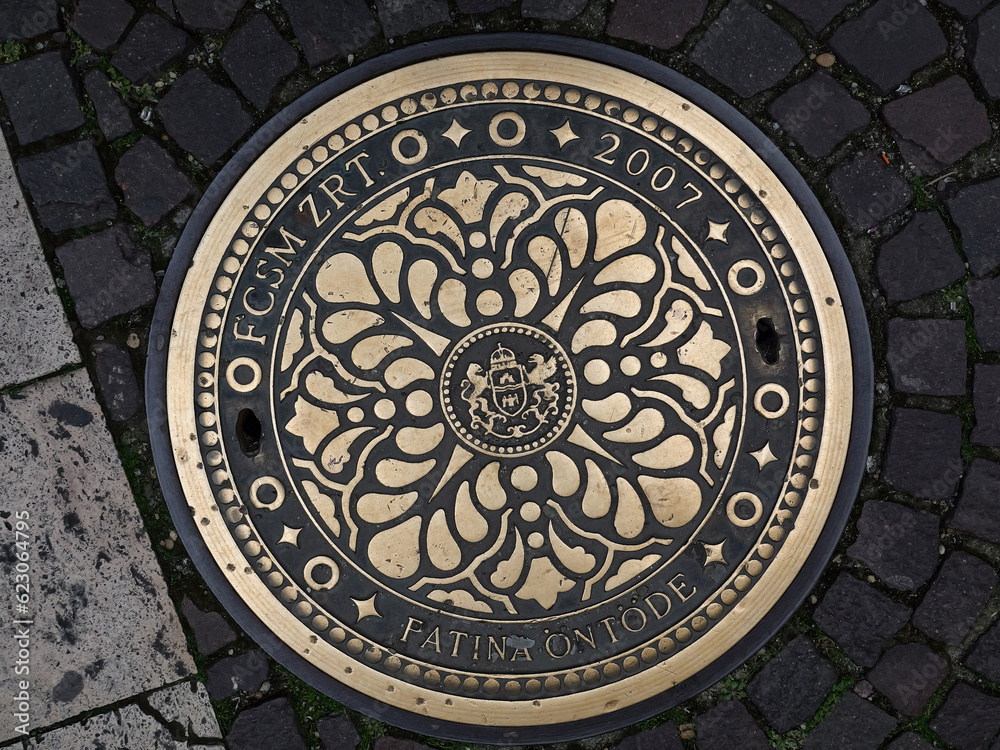 Beautiful decor of a sewer manhole in Budapest, Hungary.