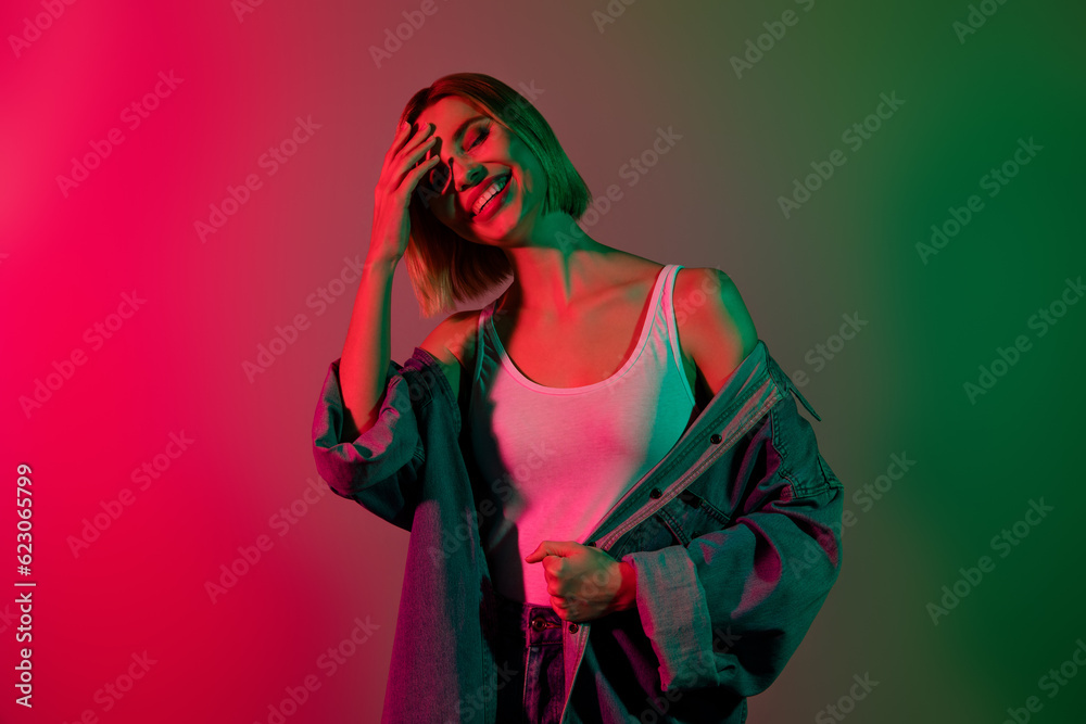 Photo of carefree sweet lady wear denim jacket enjoying party smiling isolated green pink gradient color background