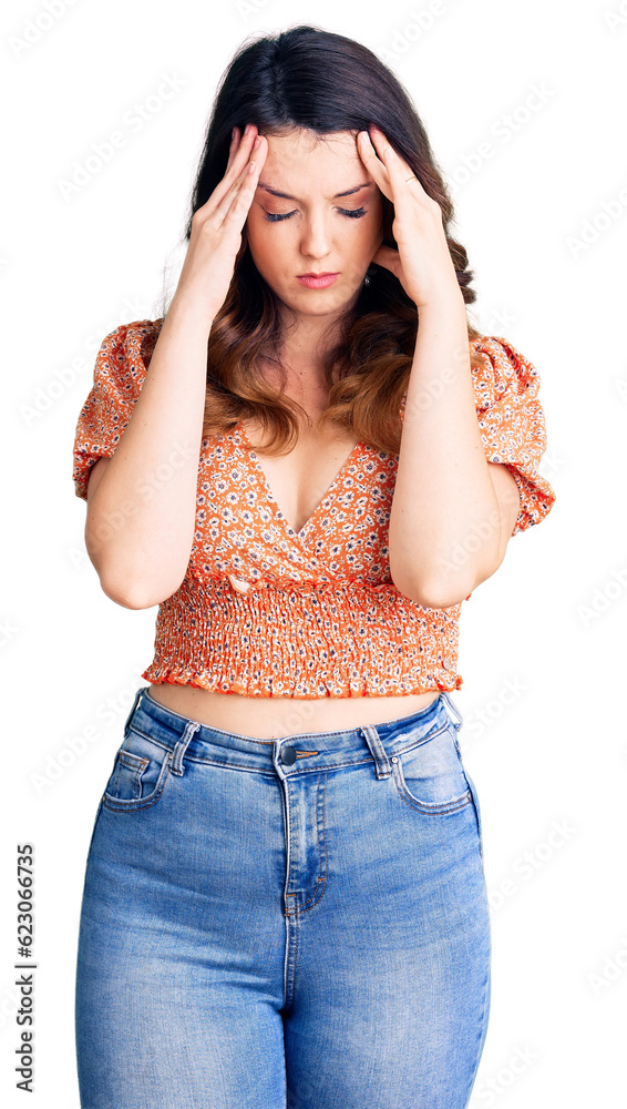 Beautiful young brunette woman wearing casual clothes with hand on head for pain in head because stress. suffering migraine.
