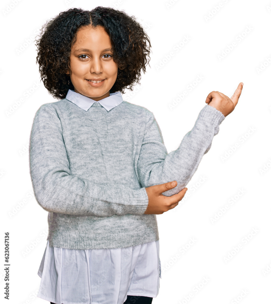 Φωτογραφία Young little girl with afro hair wearing casual clothes with a big smile on face, pointing with hand and finger to the side looking at the camera