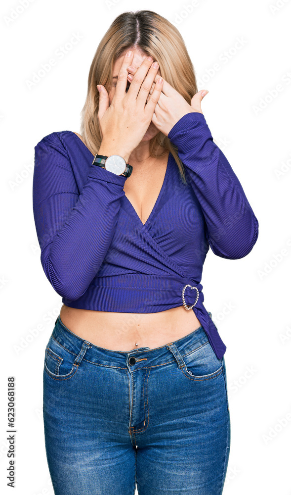 Young caucasian woman wearing casual clothes with sad expression covering face with hands while crying. depression concept. Young caucasian woman wearing casual clothes with sad expression covering face with hands while crying. depression concept.