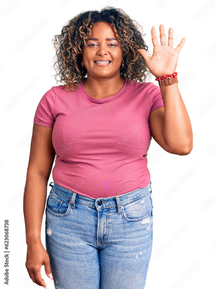 Young african american plus size woman wearing casual clothes showing and pointing up with fingers number five while smiling confident and happy. Young african american plus size woman wearing casual clothes showing and pointing up with fingers number five while smiling confident and happy.