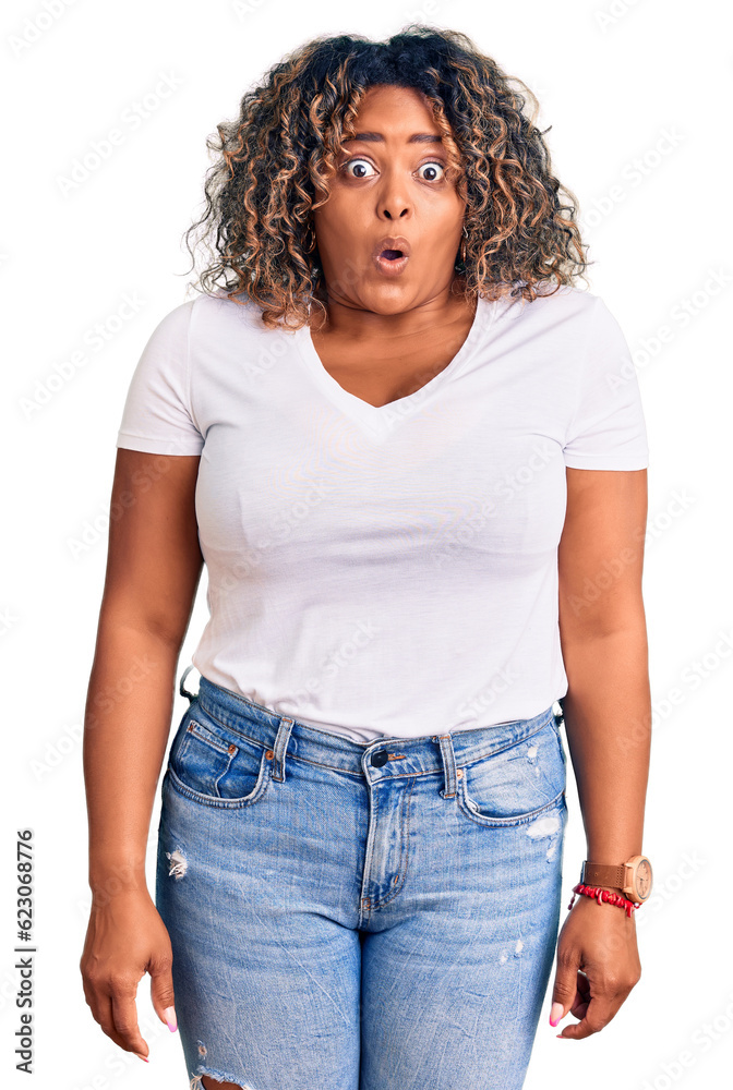 Young african american plus size woman wearing casual clothes afraid and shocked with surprise expression, fear and excited face. Young african american plus size woman wearing casual clothes afraid and shocked with surprise expression, fear and excited face.