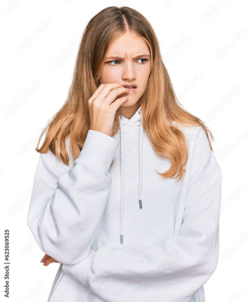 Beautiful young caucasian girl wearing casual sweatshirt looking stressed and nervous with hands on mouth biting nails. anxiety problem. Beautiful young caucasian girl wearing casual sweatshirt looking stressed and nervous with hands on mouth biting nails. anxiety problem.