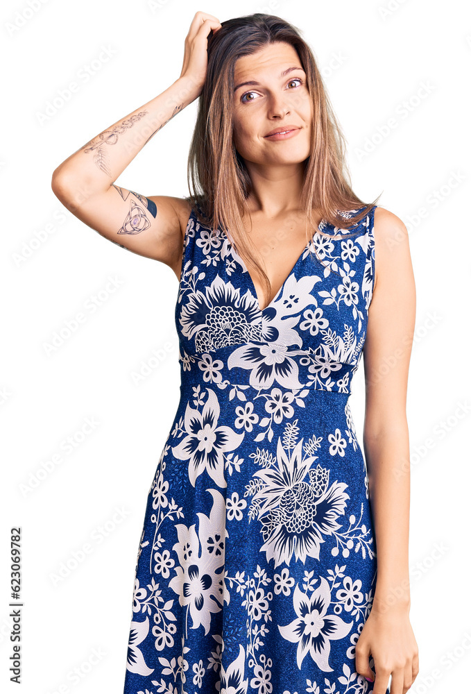 Beautiful caucasian woman wearing summer dress confuse and wonder about question. uncertain with doubt, thinking with hand on head. pensive concept. Beautiful caucasian woman wearing summer dress confuse and wonder about question. uncertain with doubt, thinking with hand on head. pensive concept.