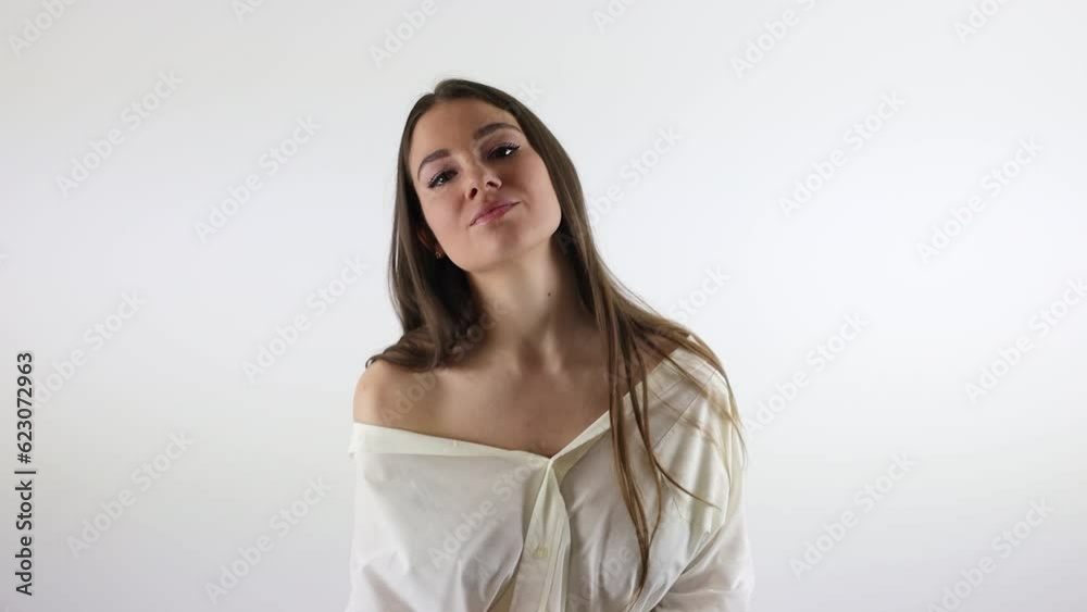 Stunning female model moving and singing in front of a white background Stunning female model moving and singing in front of a white background