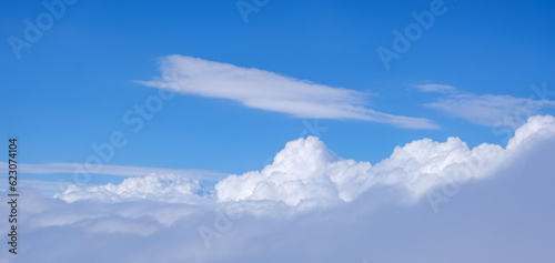 cloudscape from above. blue sky cumulus clouds. earth from above © Michalis Palis