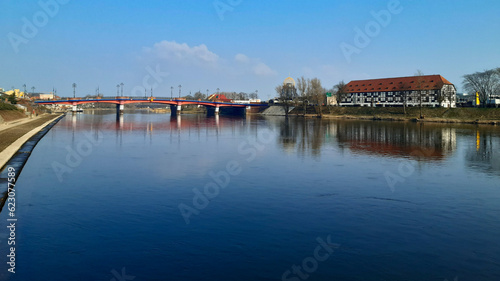 Poland, Gorzow Wielkopolski: View of the Warta River, the bridge and the White Barn - an interesting monument of the 18th century, now a branch of the Lubusz Museum.