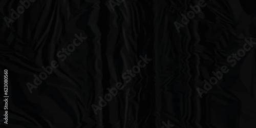Dark black crumpled paper texture background. black crumpled and top view textures can be used for background of text or any contents.