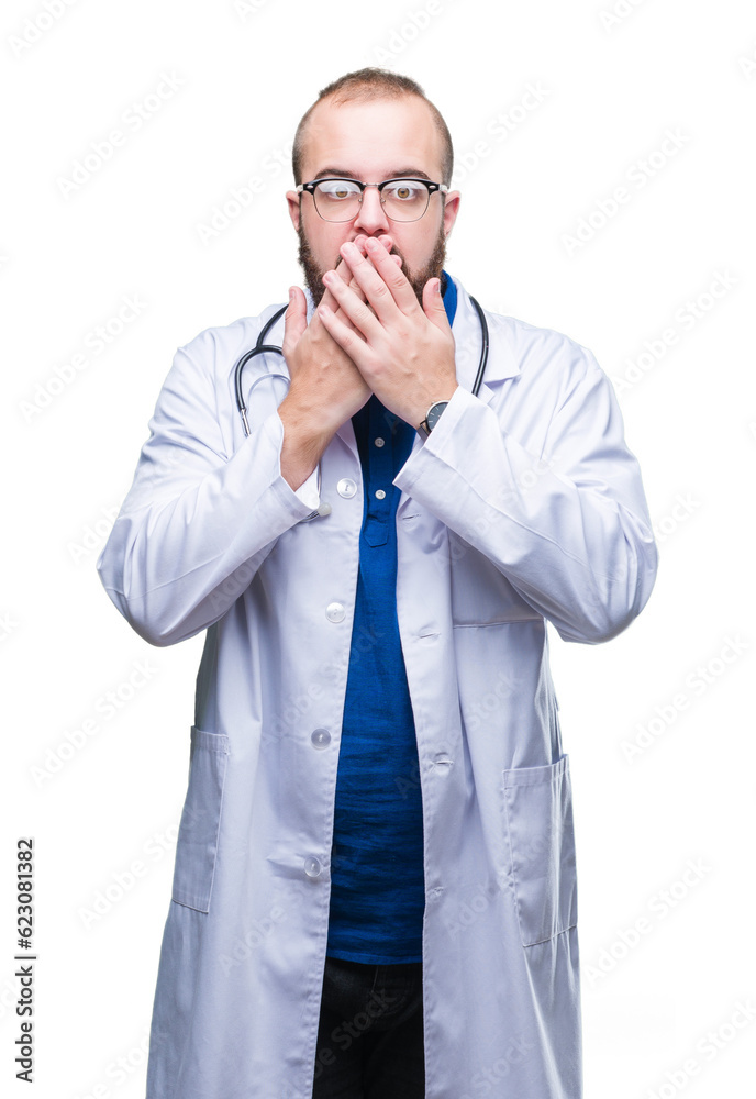 Young caucasian doctor man wearing medical white coat over isolated background bored yawning tired covering mouth with hand. Restless and sleepiness. Young caucasian doctor man wearing medical white coat over isolated background bored yawning tired covering mouth with hand. Restless and sleepiness.