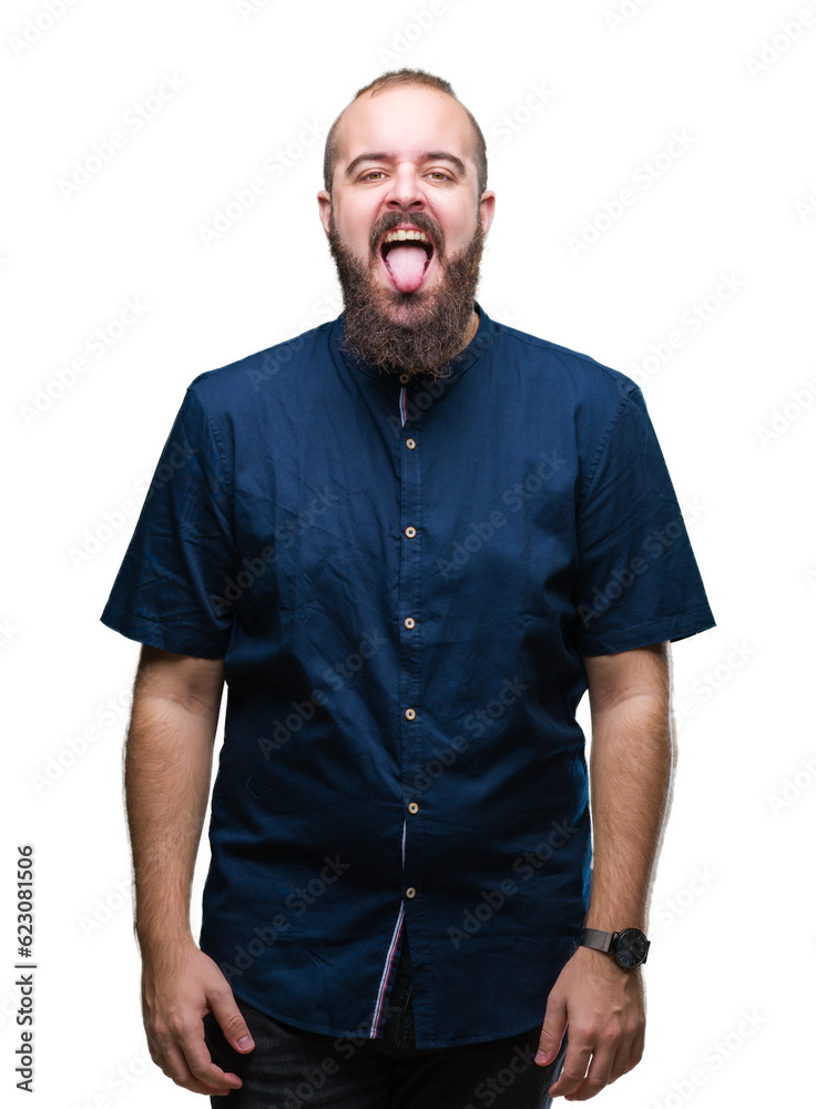 Young caucasian hipster man over isolated background sticking tongue out happy with funny expression. Emotion concept. Young caucasian hipster man over isolated background sticking tongue out happy with funny expression. Emotion concept.