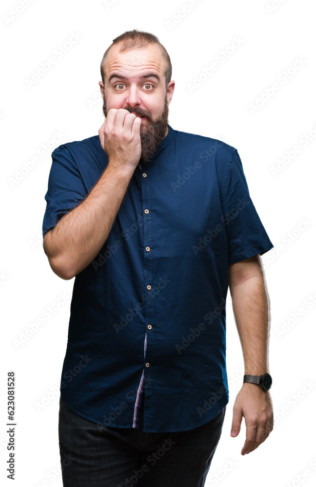 Young caucasian hipster man over isolated background looking stressed and nervous with hands on mouth biting nails. Anxiety problem. Young caucasian hipster man over isolated background looking stressed and nervous with hands on mouth biting nails. Anxiety problem.