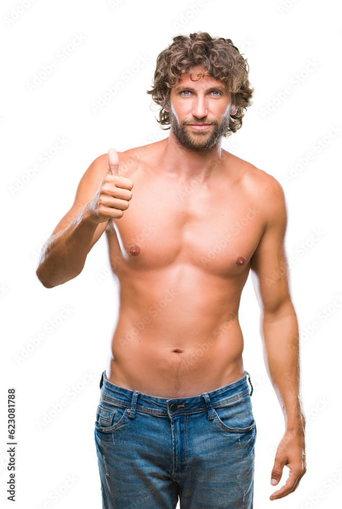 Handsome hispanic model man sexy and shirtless over isolated background doing happy thumbs up gesture with hand. Approving expression looking at the camera with showing success. Handsome hispanic model man sexy and shirtless over isolated background doing happy thumbs up gesture with hand. Approving expression looking at the camera with showing success.