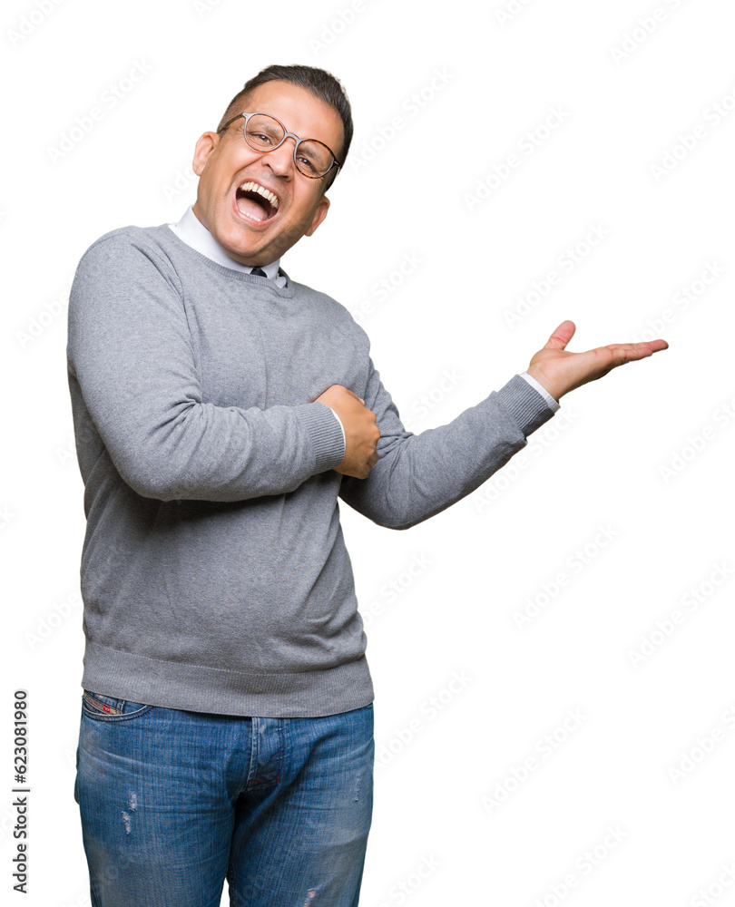 Middle age bussines arab man wearing glasses over isolated background Pointing to the side with hand and open palm, presenting ad smiling happy and confident Middle age bussines arab man wearing glasses over isolated background Pointing to the side with hand and open palm, presenting ad smiling happy and confident