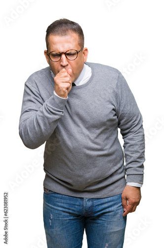 Middle age bussines arab man wearing glasses over isolated background feeling unwell and coughing as symptom for cold or bronchitis. Healthcare concept.