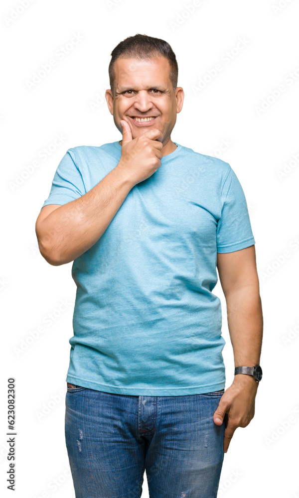 Middle age arab man wearing blue t-shirt over isolated background looking confident at the camera with smile with crossed arms and hand raised on chin. Thinking positive. Middle age arab man wearing blue t-shirt over isolated background looking confident at the camera with smile with crossed arms and hand raised on chin. Thinking positive.
