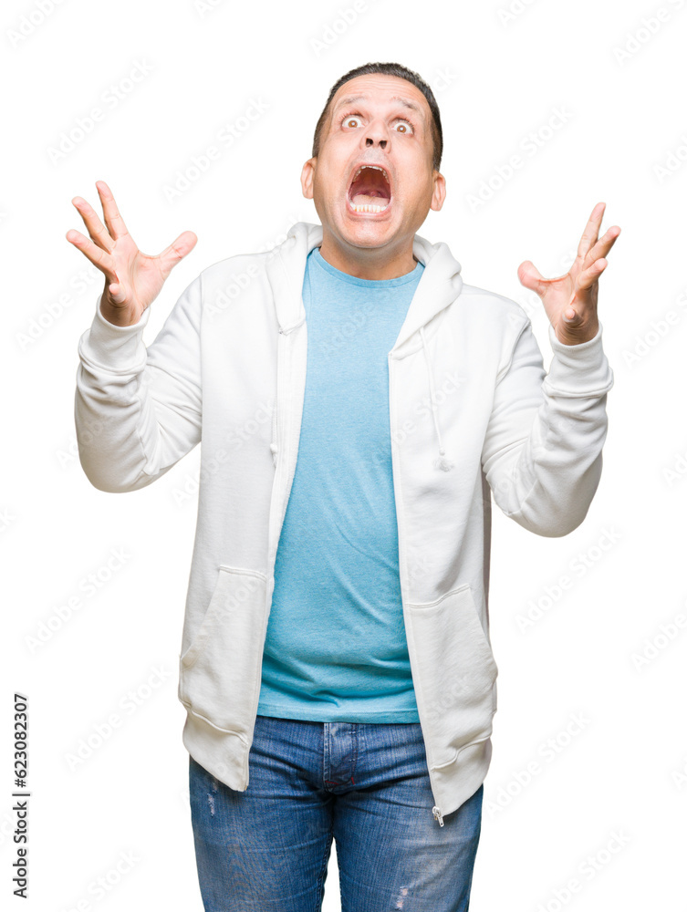 Middle age arab man wearing sweatshirt over isolated background celebrating crazy and amazed for success with arms raised and open eyes screaming excited. Winner concept Middle age arab man wearing sweatshirt over isolated background celebrating crazy and amazed for success with arms raised and open eyes screaming excited. Winner concept