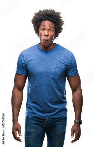 Afro american man over isolated background making fish face with lips, crazy and comical gesture. Funny expression.