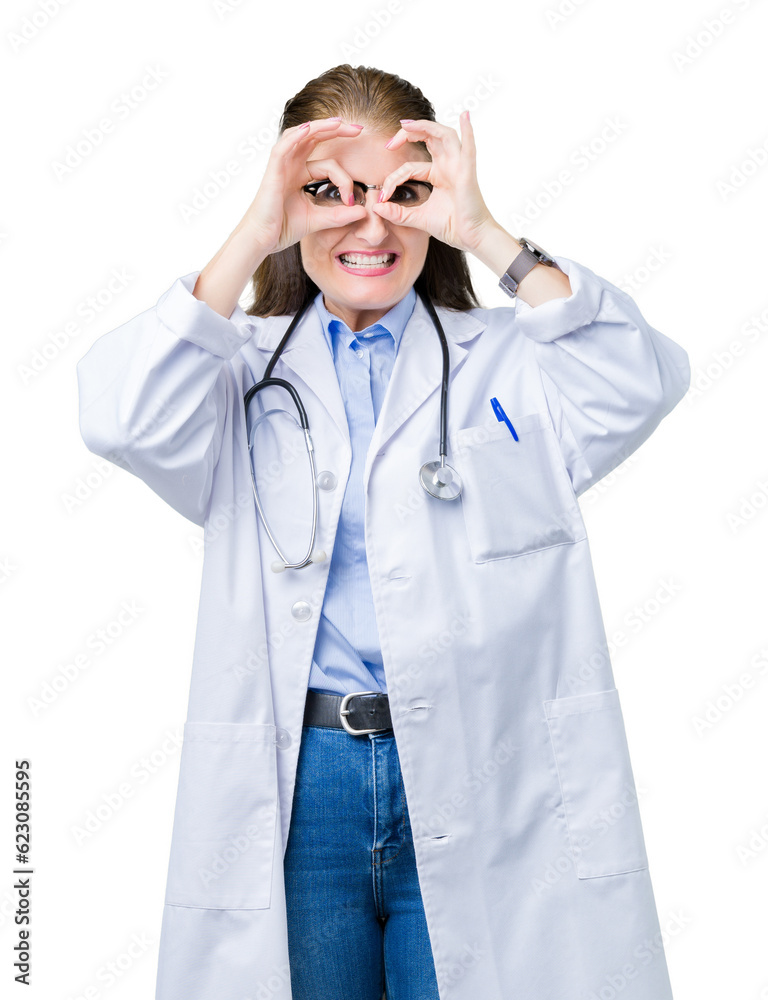 Middle age mature doctor woman wearing medical coat over isolated background doing ok gesture like binoculars sticking tongue out, eyes looking through fingers. Crazy expression. Middle age mature doctor woman wearing medical coat over isolated background doing ok gesture like binoculars sticking tongue out, eyes looking through fingers. Crazy expression.