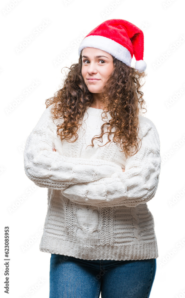 Young brunette girl wearing christmas hat over isolated background happy face smiling with crossed arms looking at the camera. Positive person. Young brunette girl wearing christmas hat over isolated background happy face smiling with crossed arms looking at the camera. Positive person.