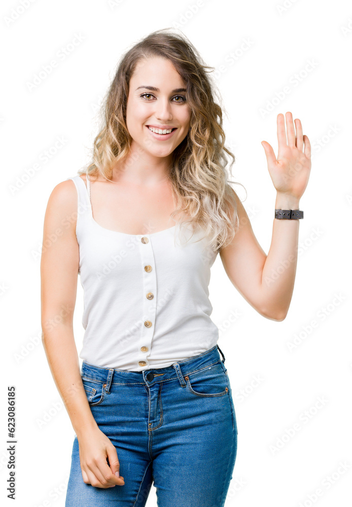 Beautiful young blonde woman over isolated background Waiving saying hello happy and smiling, friendly welcome gesture Beautiful young blonde woman over isolated background Waiving saying hello happy and smiling, friendly welcome gesture