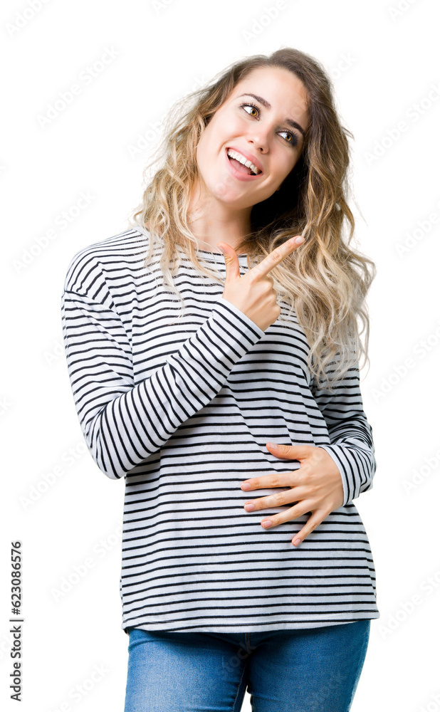 Beautiful young blonde woman wearing stripes sweater over isolated background cheerful with a smile of face pointing with hand and finger up to the side with happy and natural expression on face Beautiful young blonde woman wearing stripes sweater over isolated background cheerful with a smile of face pointing with hand and finger up to the side with happy and natural expression on face