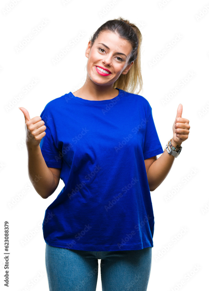 Young beautiful woman wearing casual blue t-shirt over isolated background success sign doing positive gesture with hand, thumbs up smiling and happy. Looking at the camera with cheerful expression Young beautiful woman wearing casual blue t-shirt over isolated background success sign doing positive gesture with hand, thumbs up smiling and happy. Looking at the camera with cheerful expression