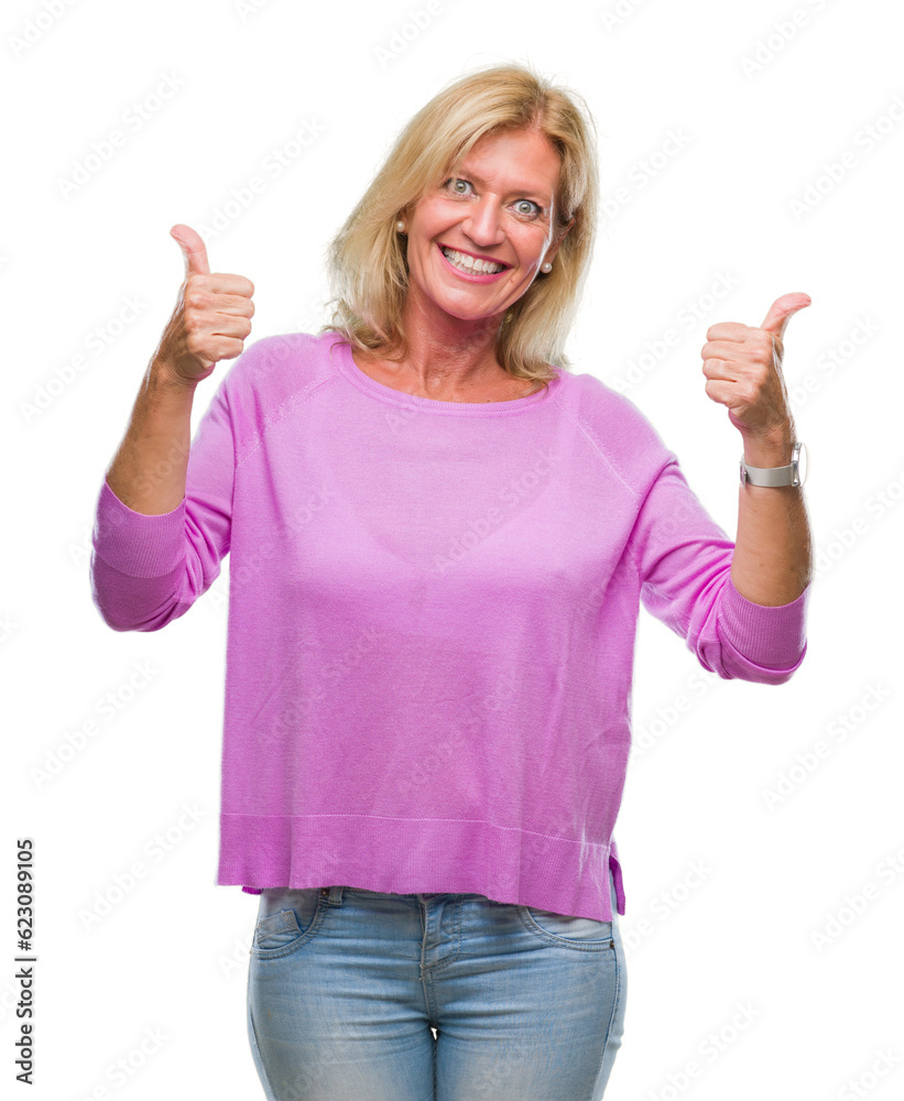 Middle age blonde woman over isolated background success sign doing positive gesture with hand, thumbs up smiling and happy. Looking at the camera with cheerful expression, winner gesture. Middle age blonde woman over isolated background success sign doing positive gesture with hand, thumbs up smiling and happy. Looking at the camera with cheerful expression, winner gesture.