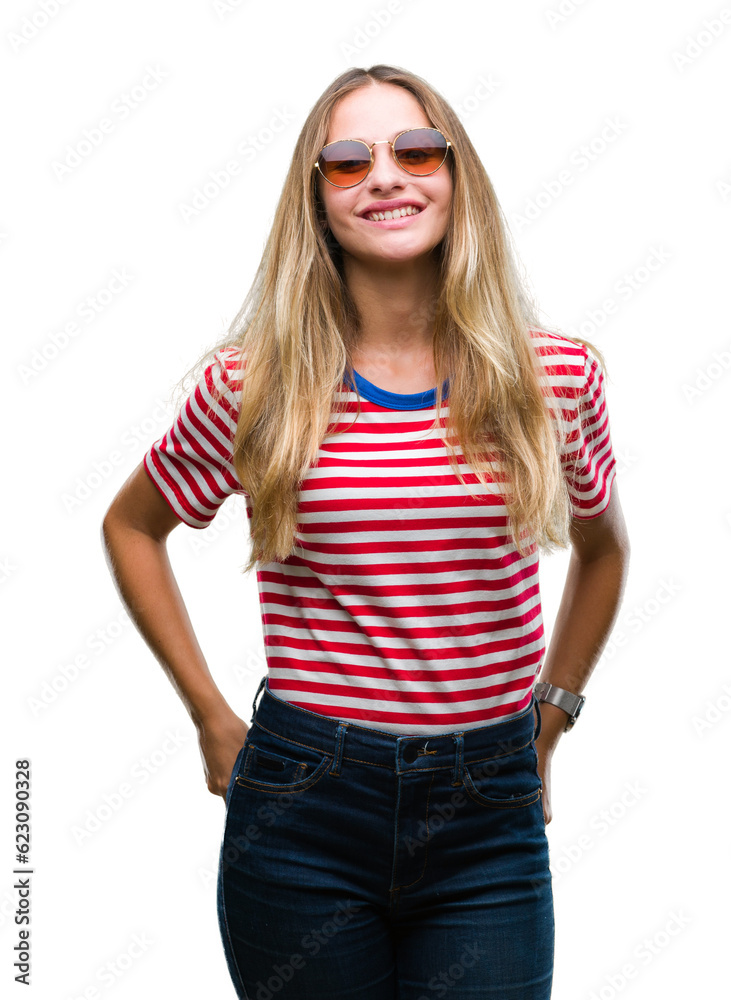 Young beautiful blonde woman wearing sunglasses over isolated background with a happy and cool smile on face. Lucky person. Young beautiful blonde woman wearing sunglasses over isolated background with a happy and cool smile on face. Lucky person.