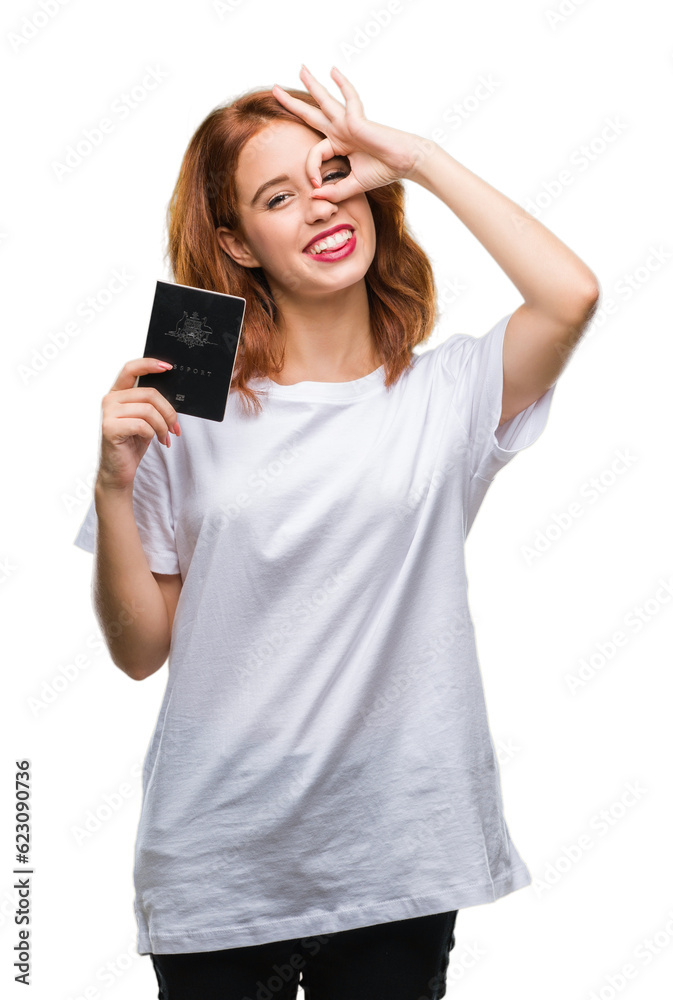 Young beautiful woman holding passport of australia over isolated background with happy face smiling doing ok sign with hand on eye looking through fingers Young beautiful woman holding passport of australia over isolated background with happy face smiling doing ok sign with hand on eye looking through fingers